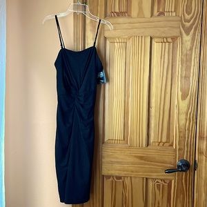 NEW Formal black dress. Size S/P. PRICE TAG STILL ON